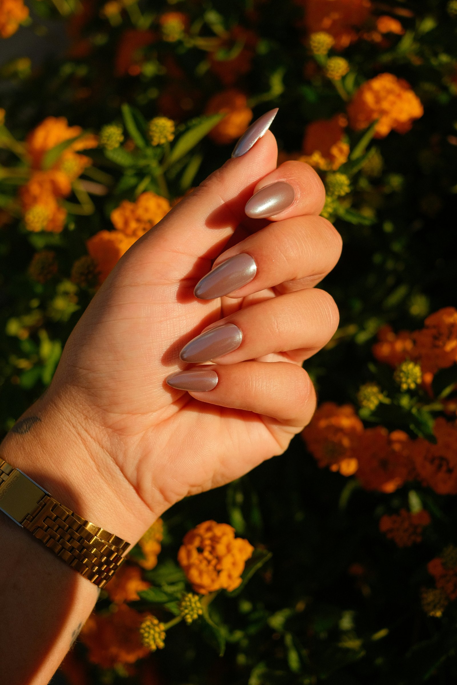 Hands receiving a signature manicure at Bloom Nails & Spa